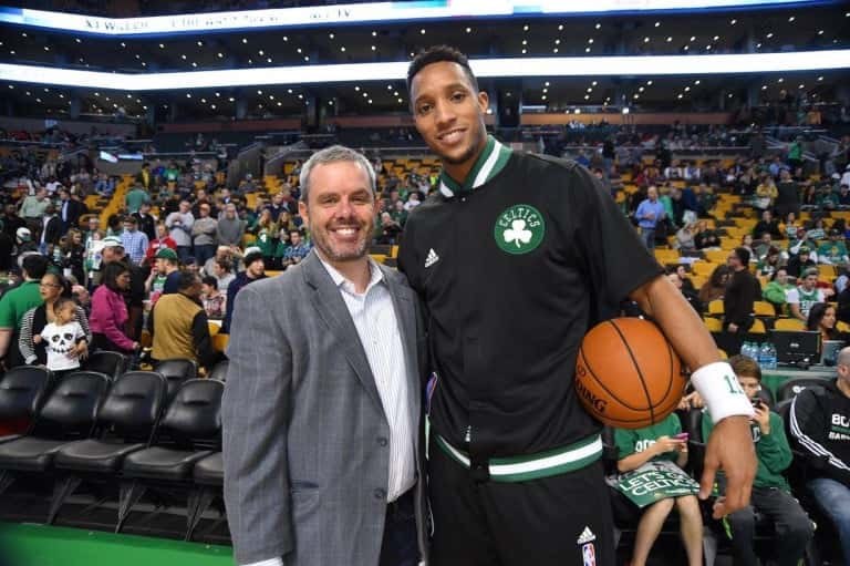 Rusty Sullivan posing with Evan Turner at TD Garden in front of a Celtics game crowd