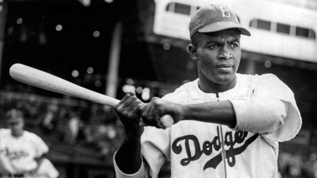 Jackie Robinson swinging a bat in warmups