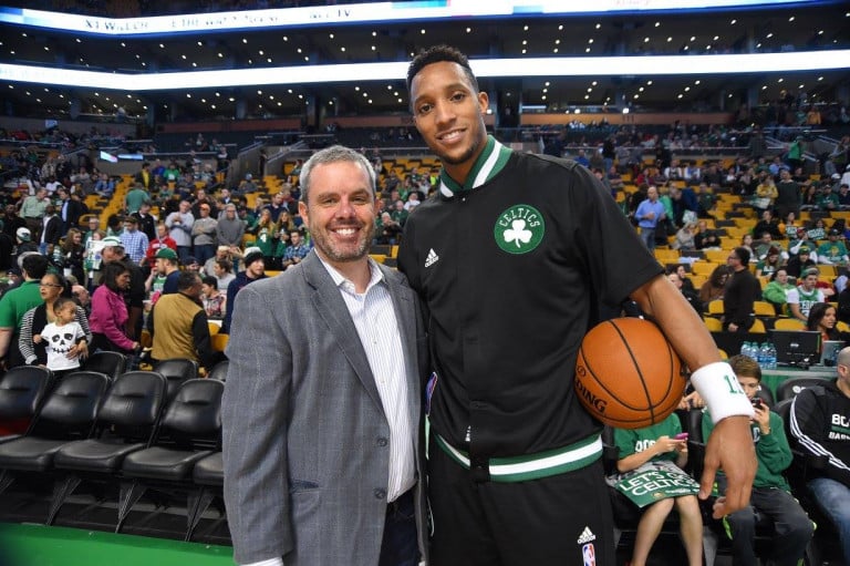 Rusty Sullivan posing with Evan Turner at TD Garden in front of a Celtics game crowd