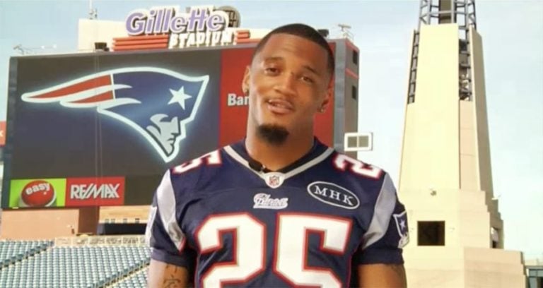 a New England Patriots player posing at Gillette Stadium