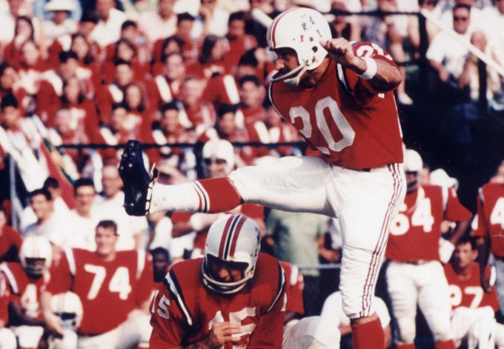 Patriots legend Gino Cappelletti kicking a football